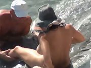 Mature couple fooling around in the surf providing each other oral fuck-a-thon